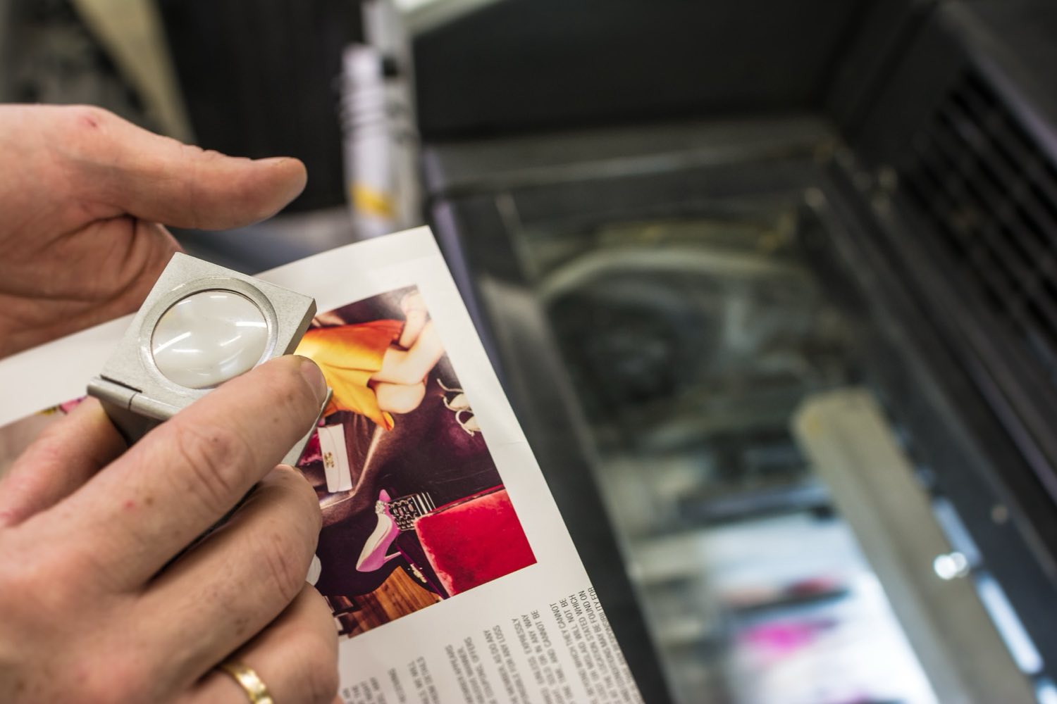Offset press rollers running a vivid full-color print job